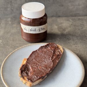 a photo of a jar of Nut-Free Chocolate Spread and chocolate spread on toast