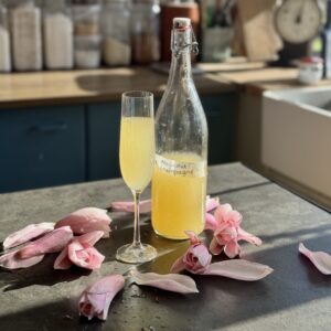 a photo of a glass and a bottle of Magnolia Champagne (Non-Alcoholic)