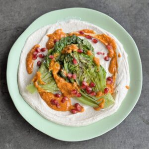 a photo of Grilled Lettuce on Tahini Cream