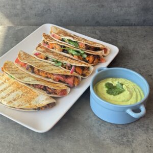 a photo of Sweet Potato & Black Bean Tacos with a Guacamole Cream