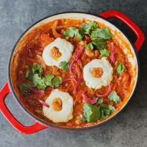 a photo of High-Protein Red Pepper Pesto Shakshuka with Whipped Tofu Eggs
